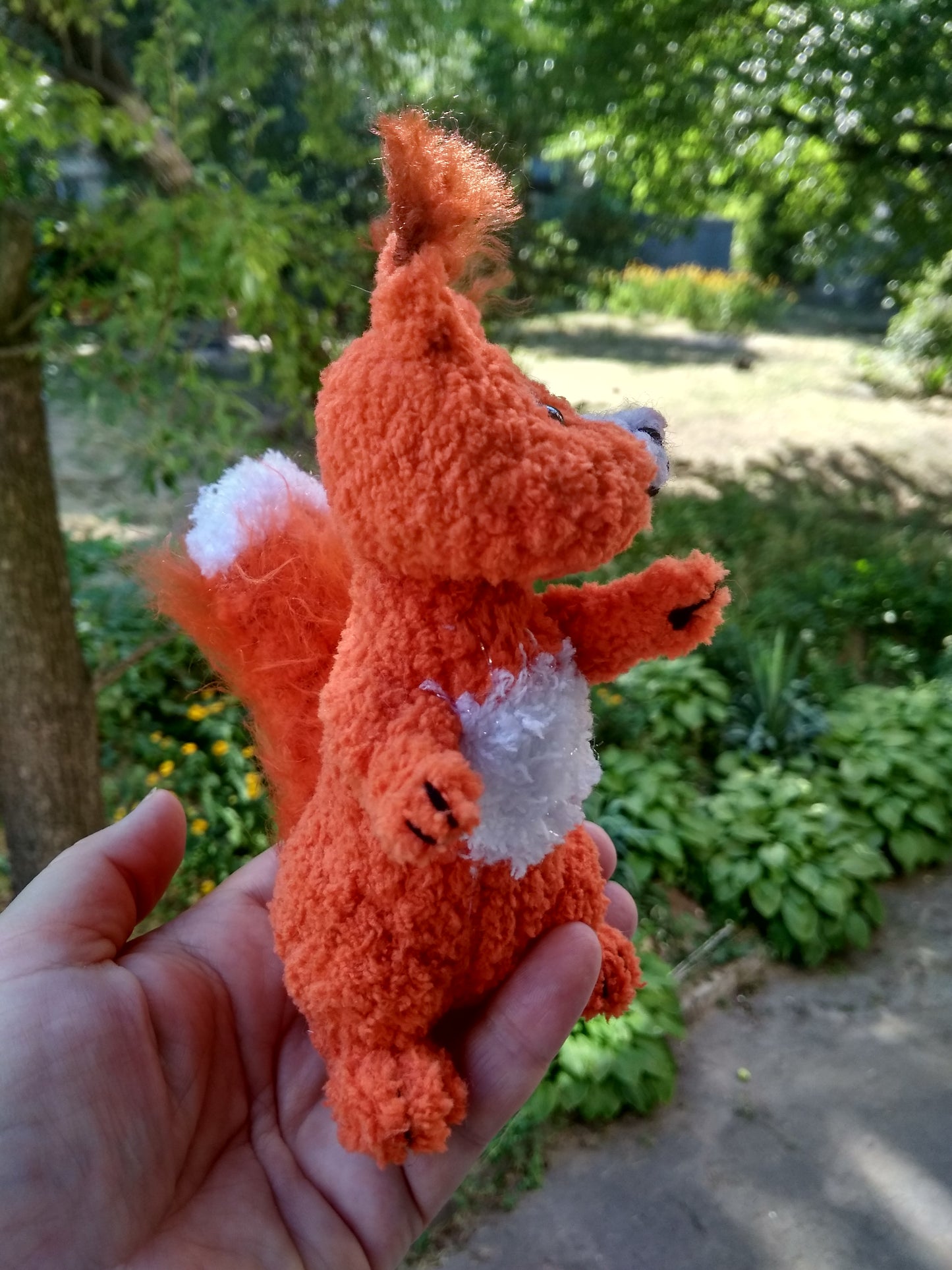 Plush knitted squirrel figurine for home decor. Stuffed cute squirrel toy