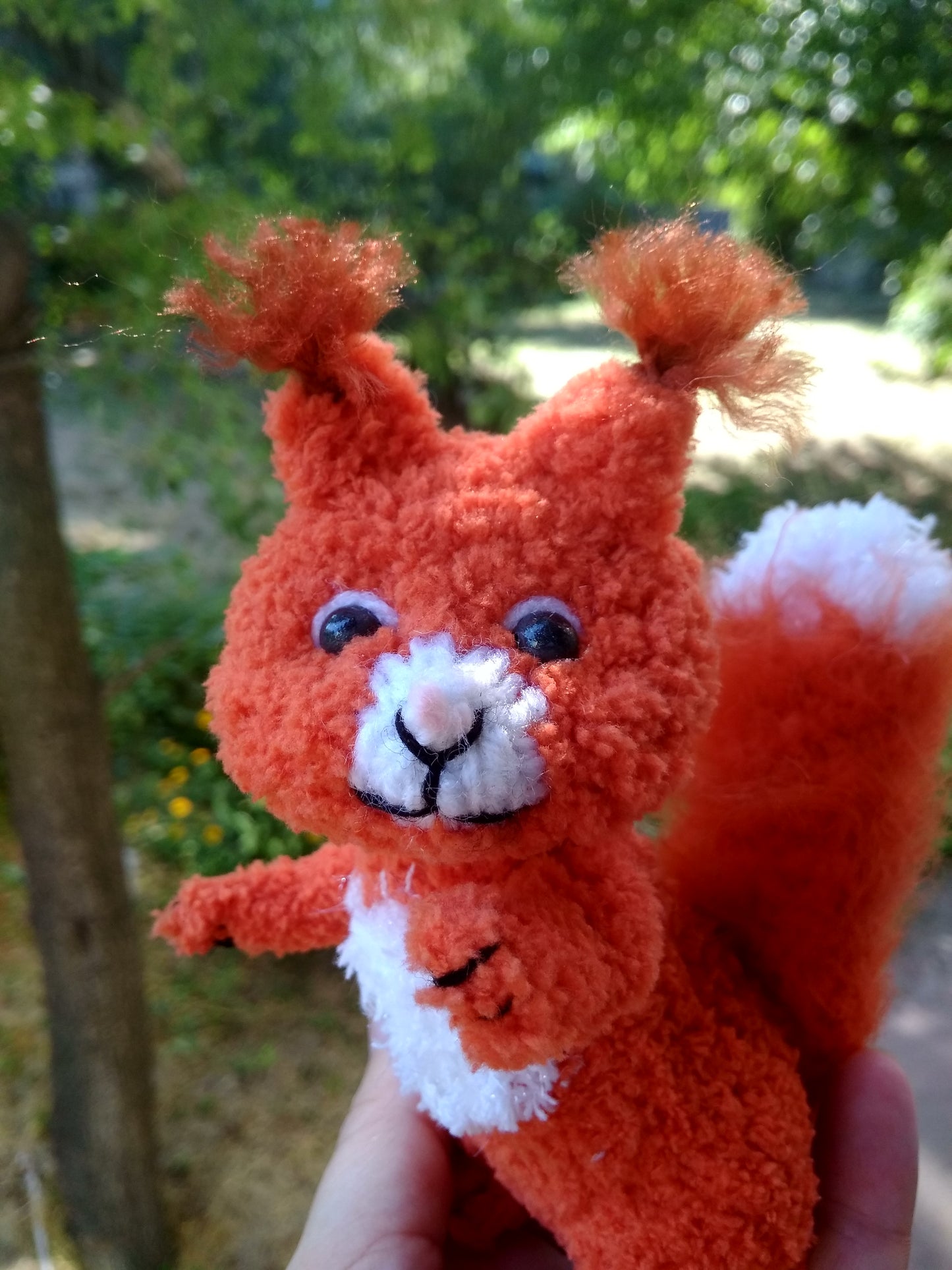 Plush knitted squirrel figurine for home decor. Stuffed cute squirrel toy