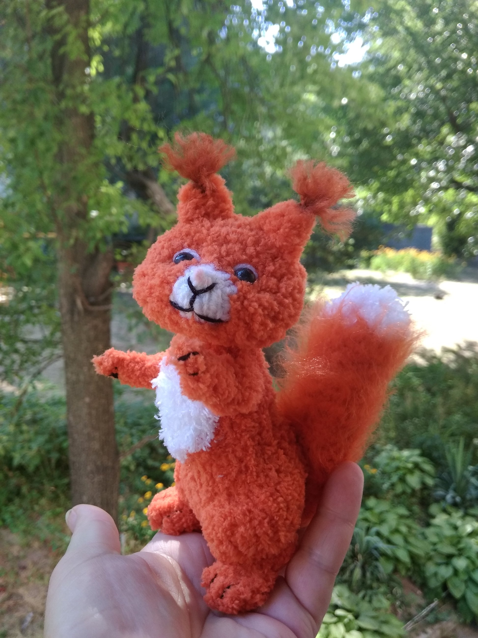 Plush knitted squirrel figurine for home decor. Stuffed cute squirrel toy