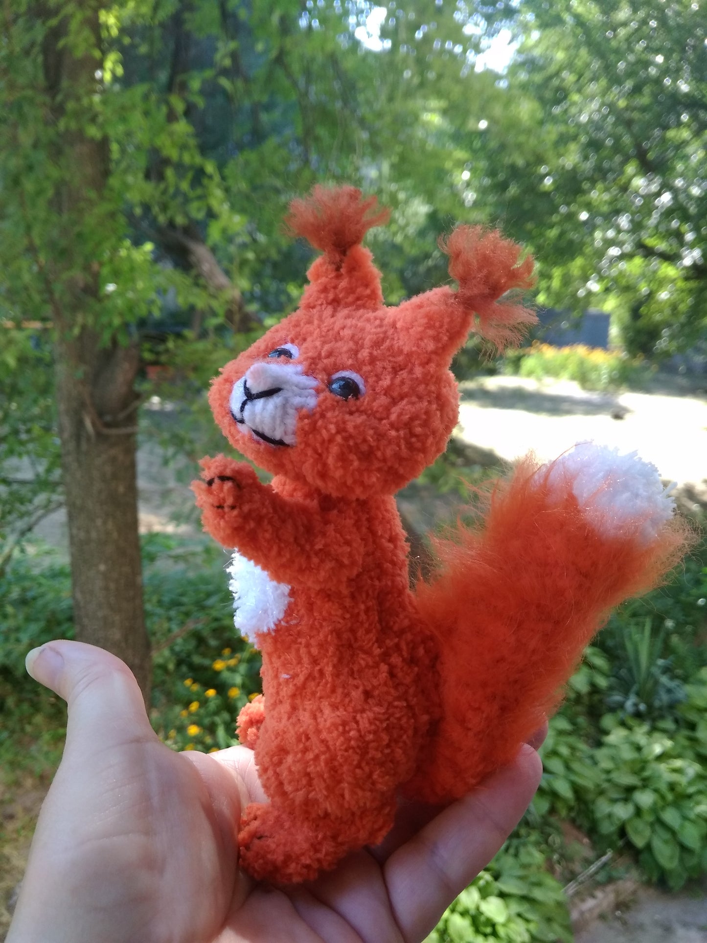 Plush knitted squirrel figurine for home decor. Stuffed cute squirrel toy