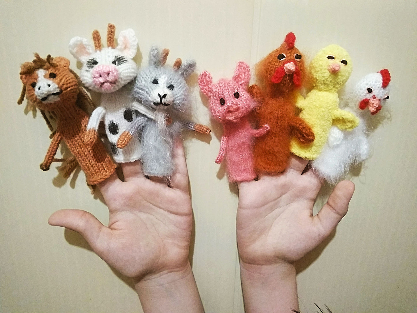 cute finger puppets in the form of farm animals - cow, goat, horse, chicken, rooster, hen and pig